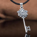 Sterling Silver Key Pendant with Bird and Flower Design