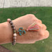 Bohemian Earth Tone Bead Bracelet with Namaste Charm and Colorful Tassel